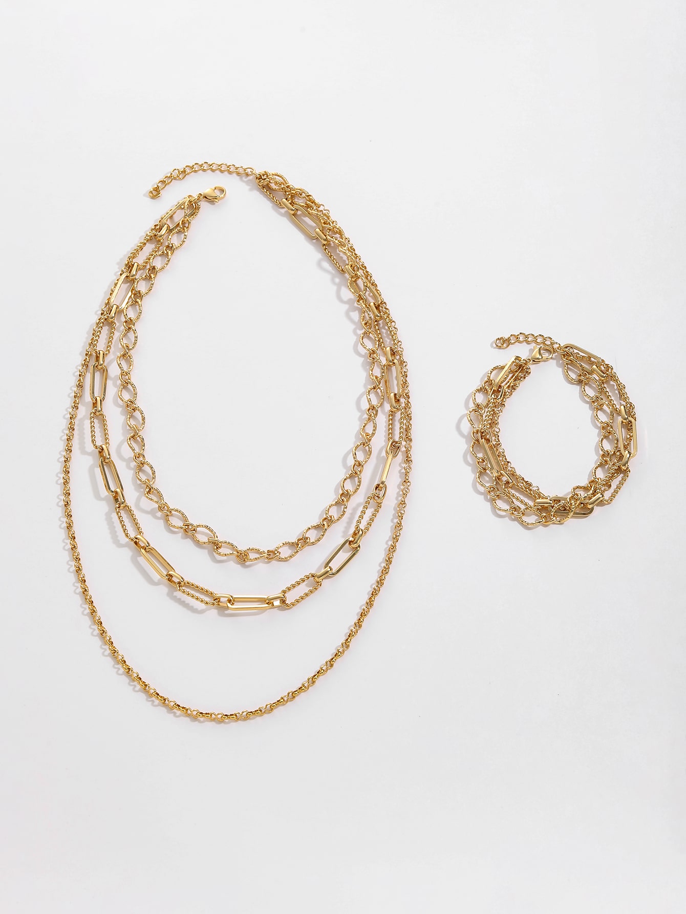 Stylish Gold Jewelry Set Featuring Three Chain Types